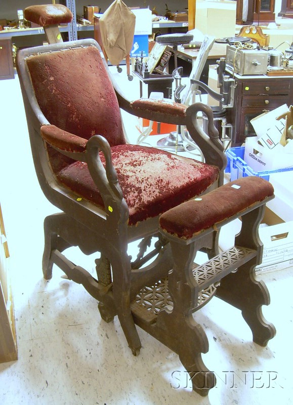 Appraisal: Empire Cast Iron-mounted and Upholstered Carved Walnut Mechanical Barber Chair