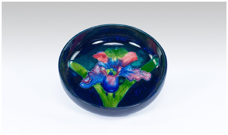 Appraisal: Moorcroft Small 'Orchid' Bowl Deep Blue Footed Bowl with Red