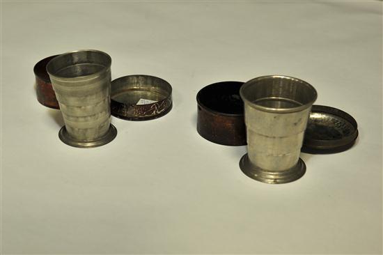 Appraisal: TWO COLLAPSIBLE DRINKING CUPS American rd quarter- th century pewter