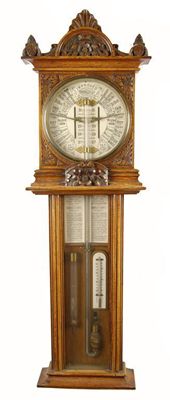 Appraisal: A carved oak cased 'Improved Torricelli Barometer' with a inch