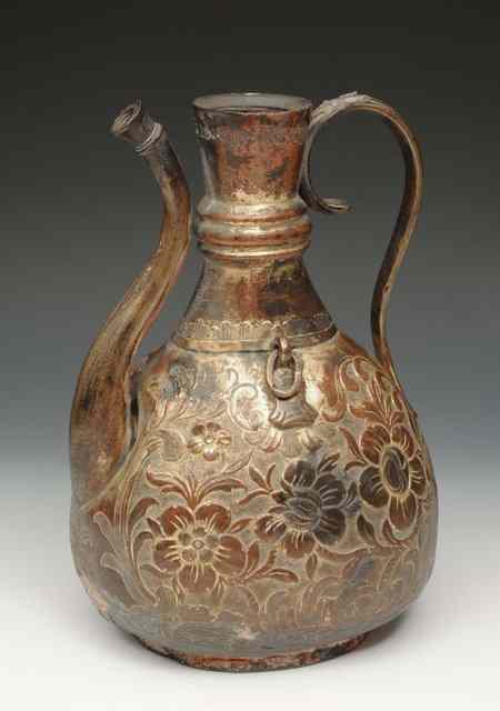 Appraisal: A TURKISH OTTOMAN TOMBAC GILT COPPER EWER flower head and