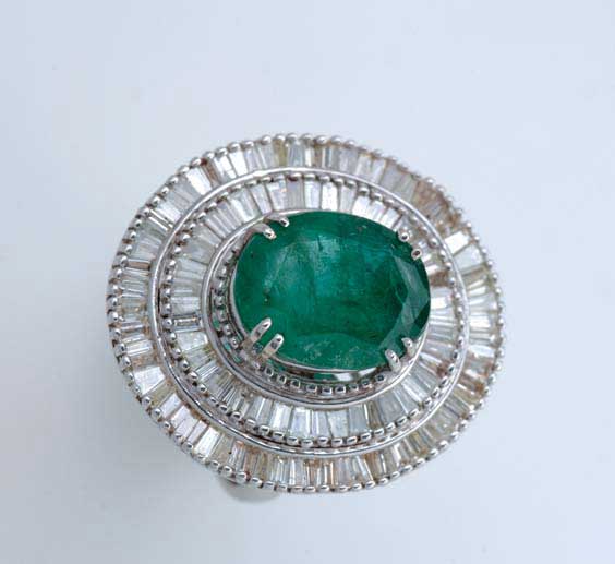 Appraisal: EMERALD DIAMOND AND K GOLD RING Emerald diamond and K