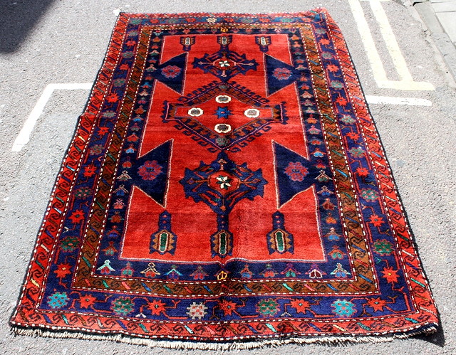 Appraisal: A MODERN RUSSIAN KASAK RED GROUND RUG with central medallion