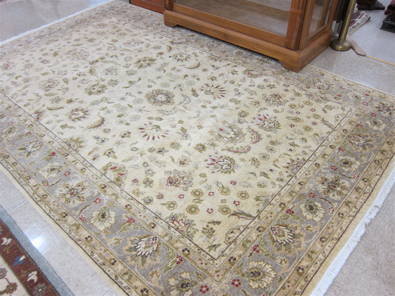 Appraisal: HAND KNOTTED ORIENTAL CARPET Pakistani-Persian overall floral decoration on khaki