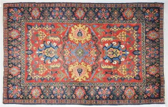 Appraisal: MALAYER old Rust coloured central field patterned with stylised blossoms