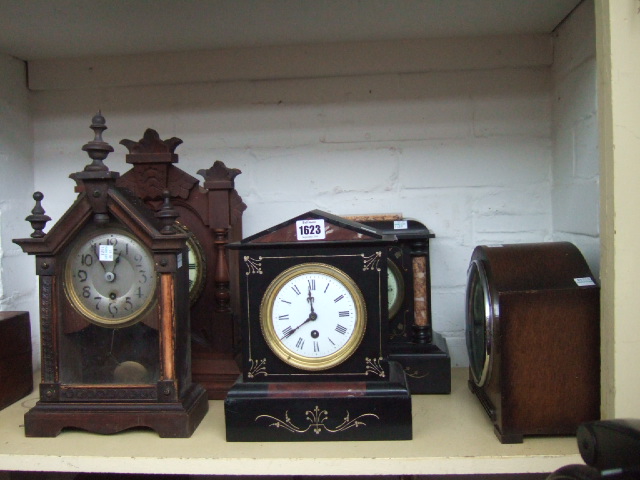 Appraisal: Two Victorian black slate cased mantel clocks three other mantel