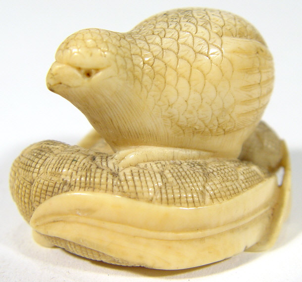 Appraisal: Oriental carved ivory quail netsuke signature to the base cm