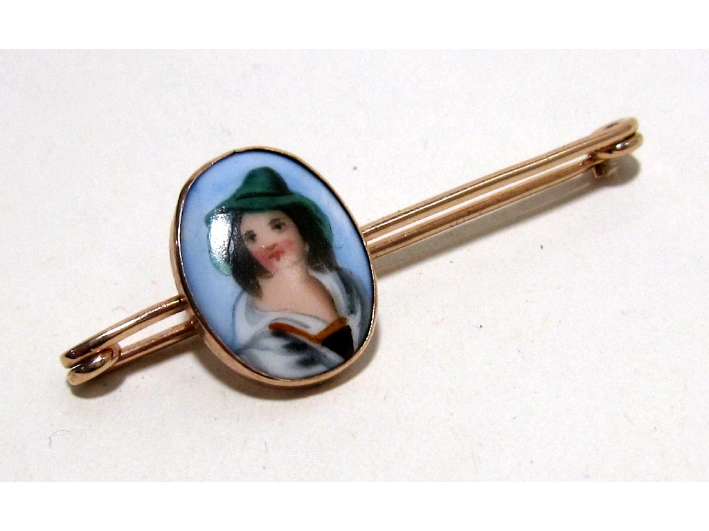 Appraisal: Nine carat gold bar brooch with hand painted porcelain portrait