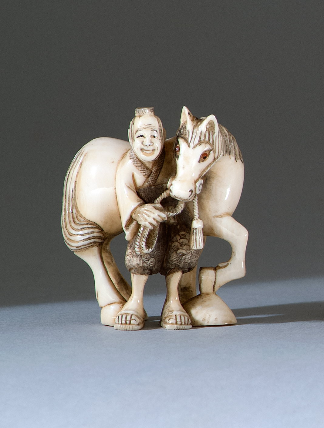 Appraisal: IVORY NETSUKE th CenturyIn the form of a horse and