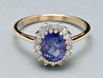 Appraisal: Lady's tanzanite and diamond ring centering one oval faceted bluish