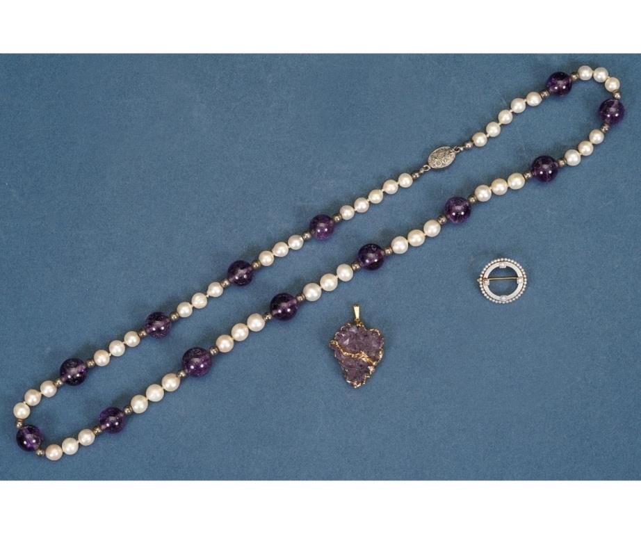 Appraisal: A graduated cultured pearl amethyst and silver bead necklace knotted