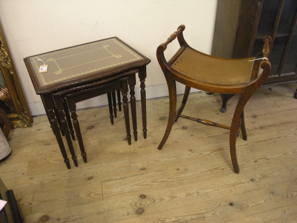 Appraisal: An early th century mahogany piano stool with turned arms