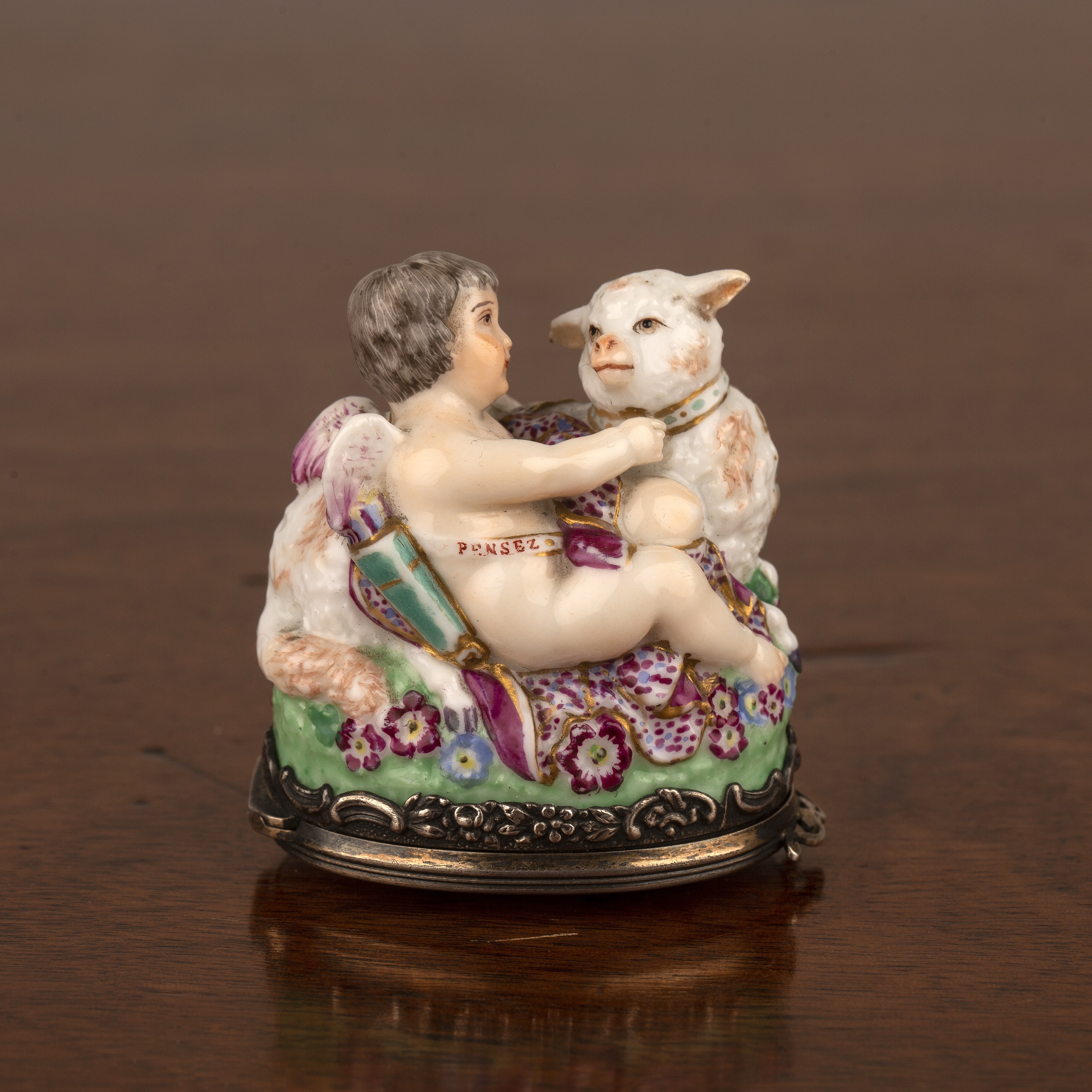 Appraisal: Porcelain bonbonierreFrench late th Century modelled as a cupid and