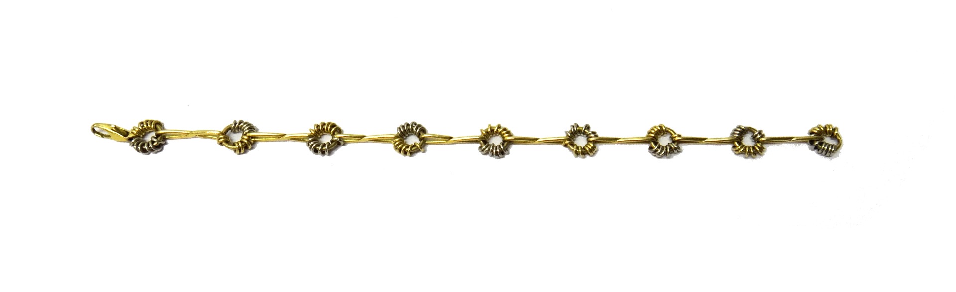 Appraisal: A Chaumet two colour gold bracelet designed as a series