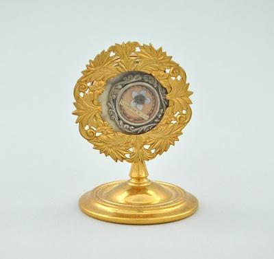 Appraisal: A Gilt Metal Reliquary Standing on a circular base with