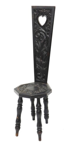 Appraisal: A Victorian ebonised oak spinning chair the heavily carved back