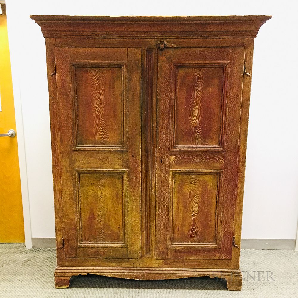 Appraisal: Grain-painted Pine Paneled Cupboard Grain-painted Pine Paneled Cupboard th century