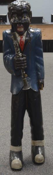 Appraisal: African American Clarinet Player Statue Made of carved wood Has