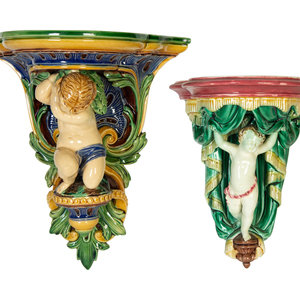 Appraisal: Two Majolica Putti Wall Brackets th Century one by Wedgwood