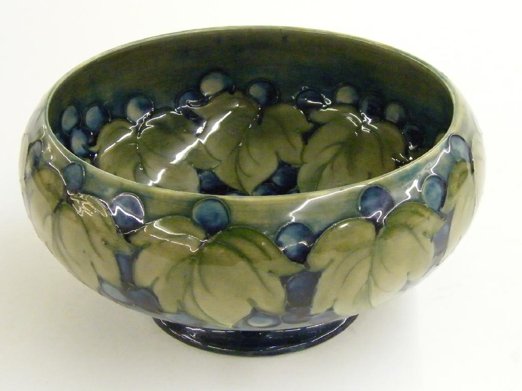 Appraisal: Moorcroft 'Leaves and Fruit' design circular pedestal bowl decorated in