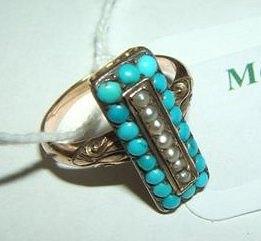 Appraisal: A turquoise and pearl set gold coloured ring