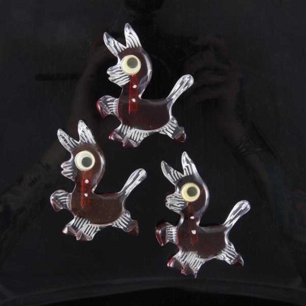 Appraisal: THREE REVERSE CARVED AND PAINTED MID-CENTURY GOOGLY EYED DONKEY FIGURAL