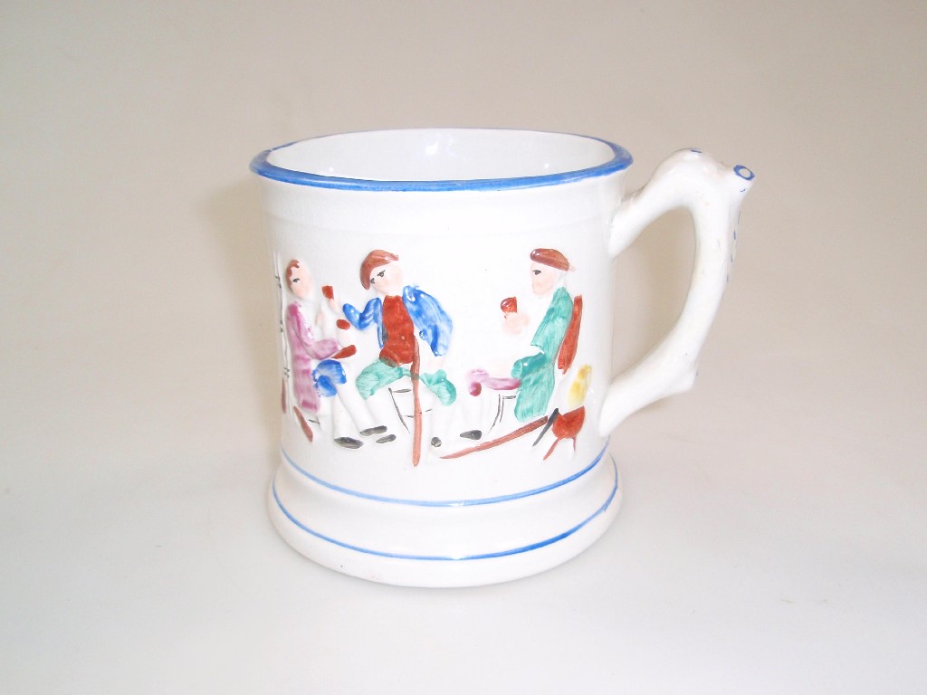 Appraisal: A Victorian frog mug with polychrome tavern scenes to the