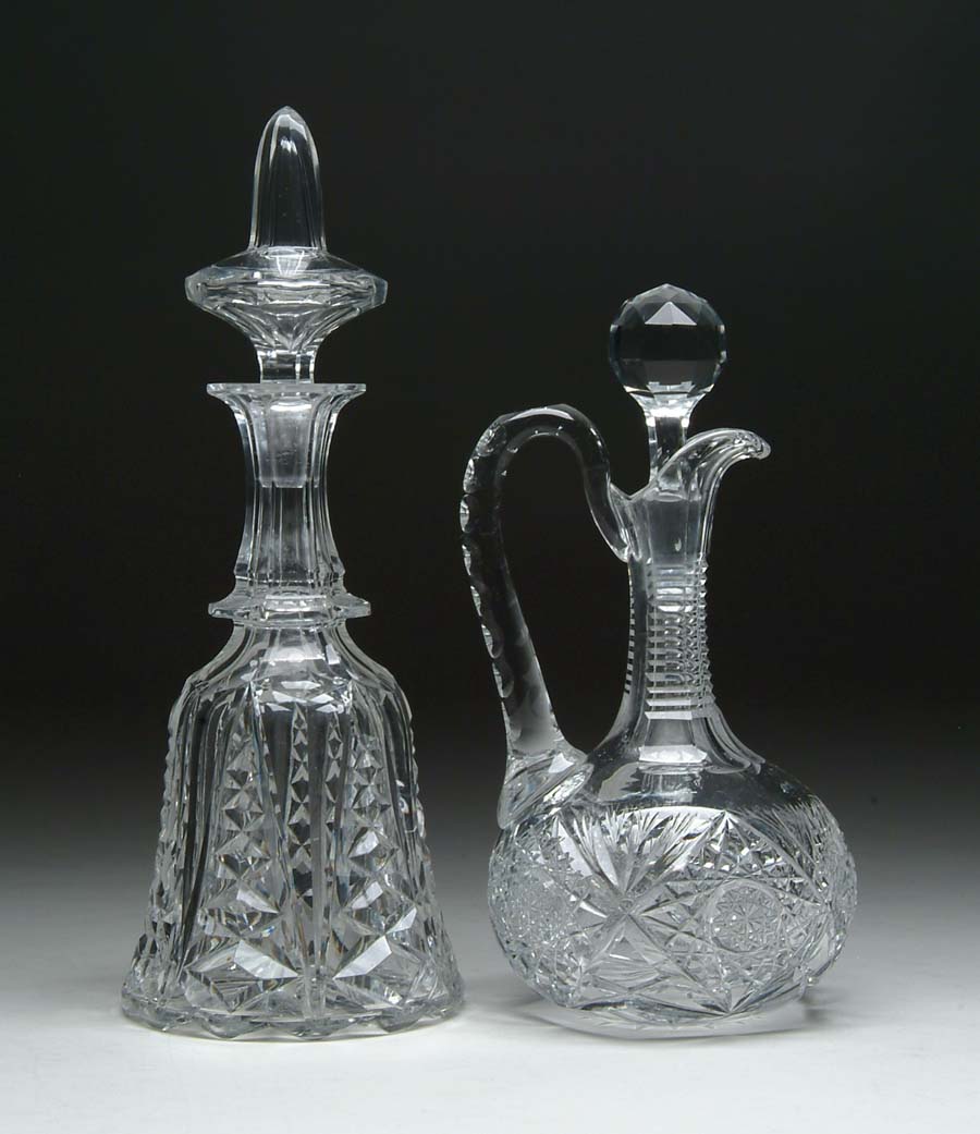 Appraisal: TWO CUT GLASS DECANTERS Handled decanter in the hobstar and