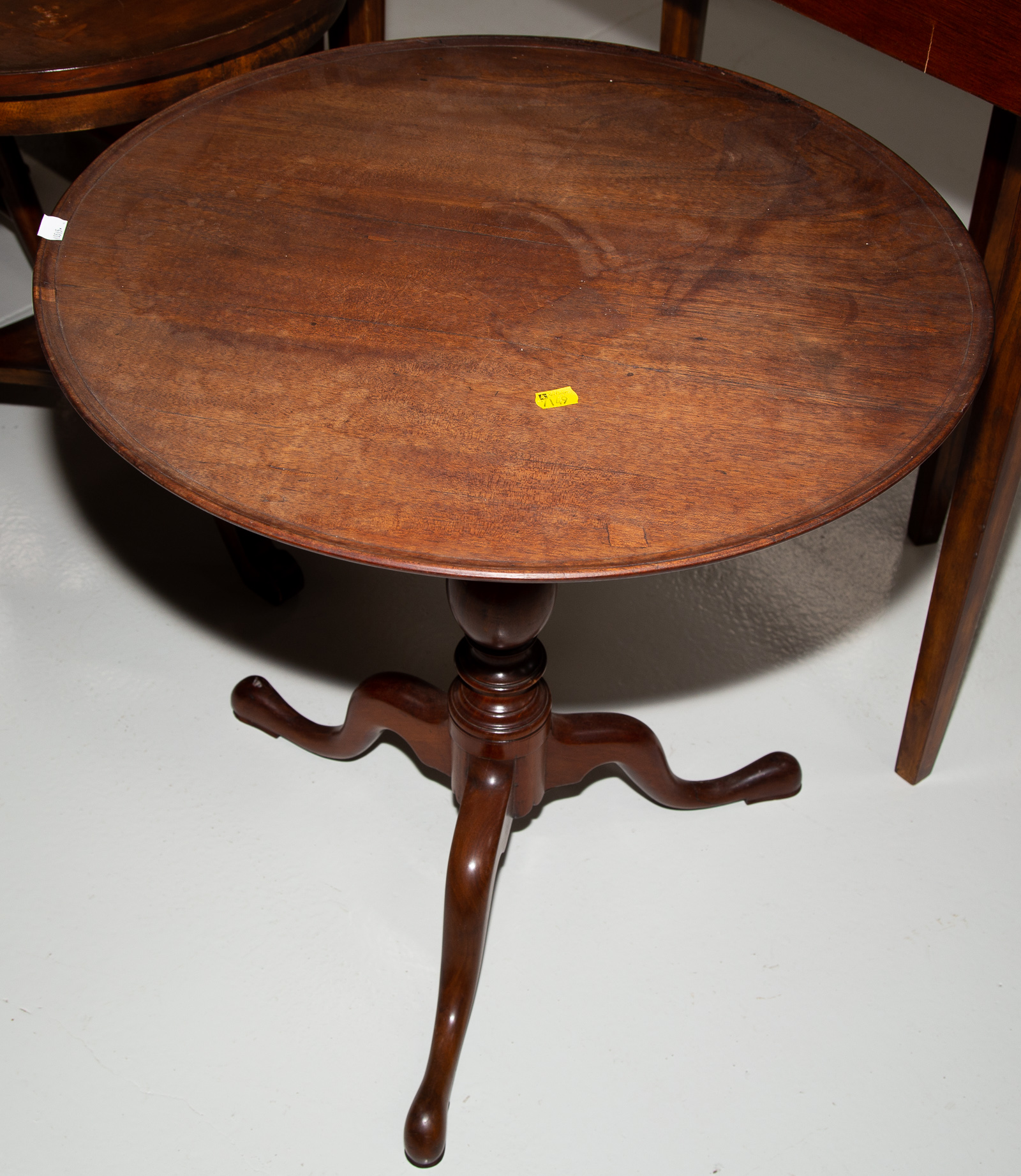 Appraisal: GEORGE III MAHOGANY TEA TABLE th century with lazy Susan