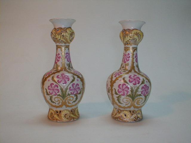 Appraisal: A pair of Doulton Lambeth Carerra bottle shape vases with