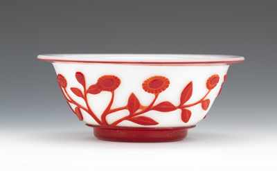 Appraisal: A Red on White Peking Glass Bowl Deeply carved floral