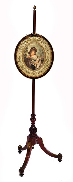 Appraisal: A TH CENTURY MAHOGANY POLE SCREEN with gilt metal pine