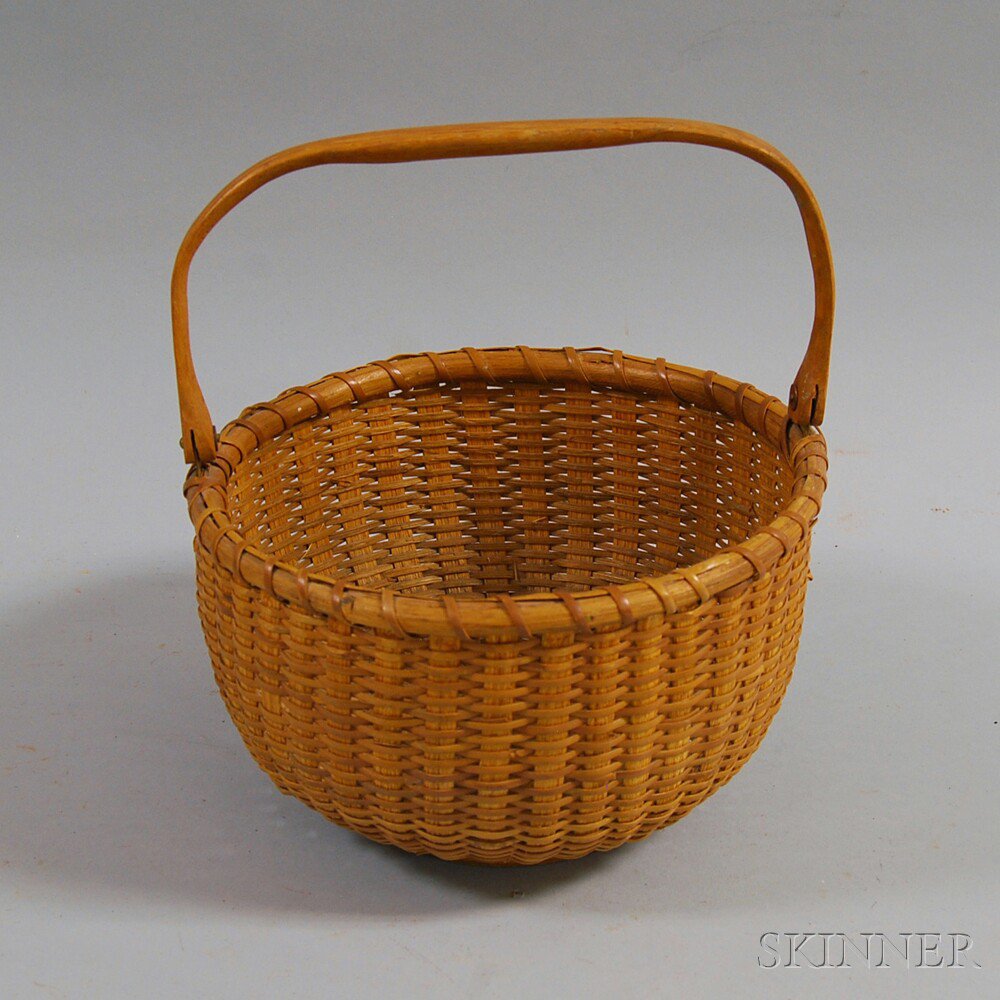 Appraisal: Nantucket-style Basket round basket with carved hardwood swing handle ht