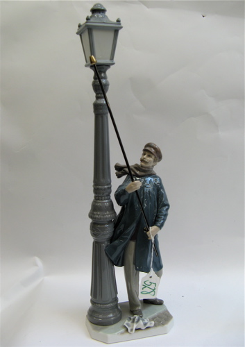 Appraisal: LLADRO GLAZED PORCELAIN FIGURINE Lamplighter sculpted by Salvador Furio -