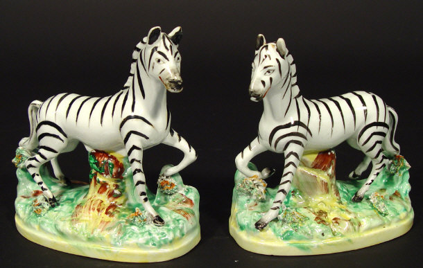 Appraisal: Pair of Staffordshire flat back zebra on green painted bases