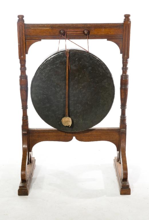 Appraisal: LATE th CENTURY OAK-FRAMED DINNER GONG with turned trestle stand