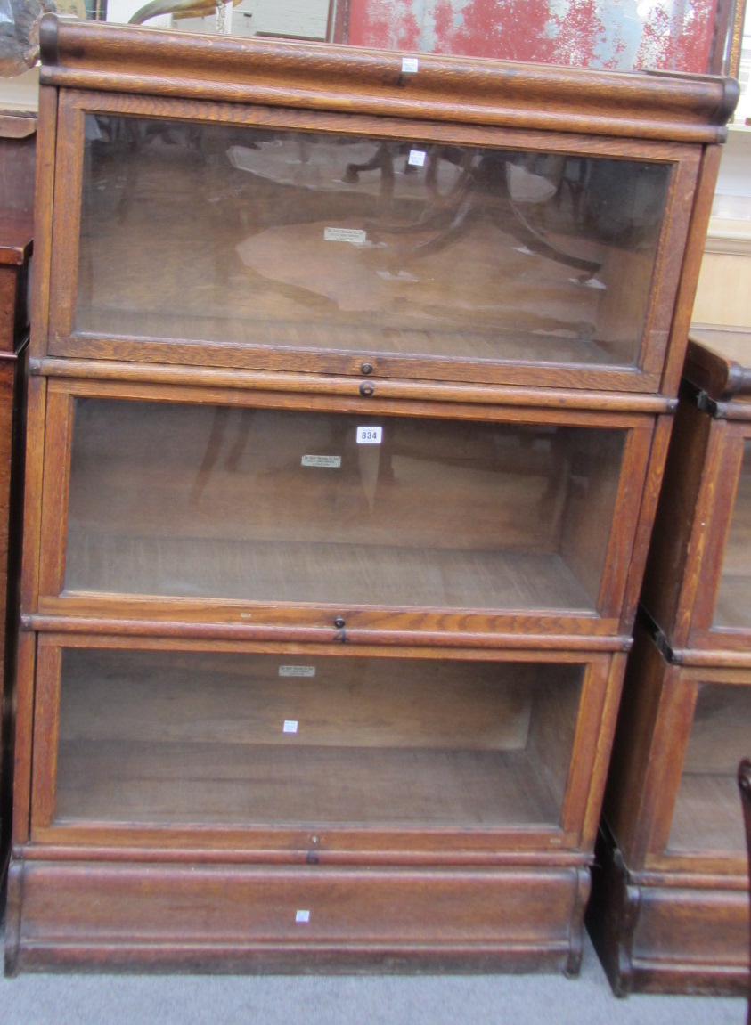 Appraisal: A th century oak Globe Wernicke three section bookcase cm