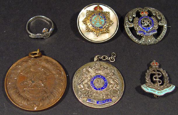 Appraisal: Five military silver and bronze pendants and brooches and a