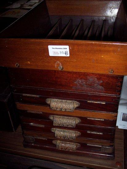 Appraisal: A mahogany change sorting machine of five stacked tiers cm