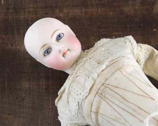 Appraisal: A late th century French bisque shoulder doll with pierced