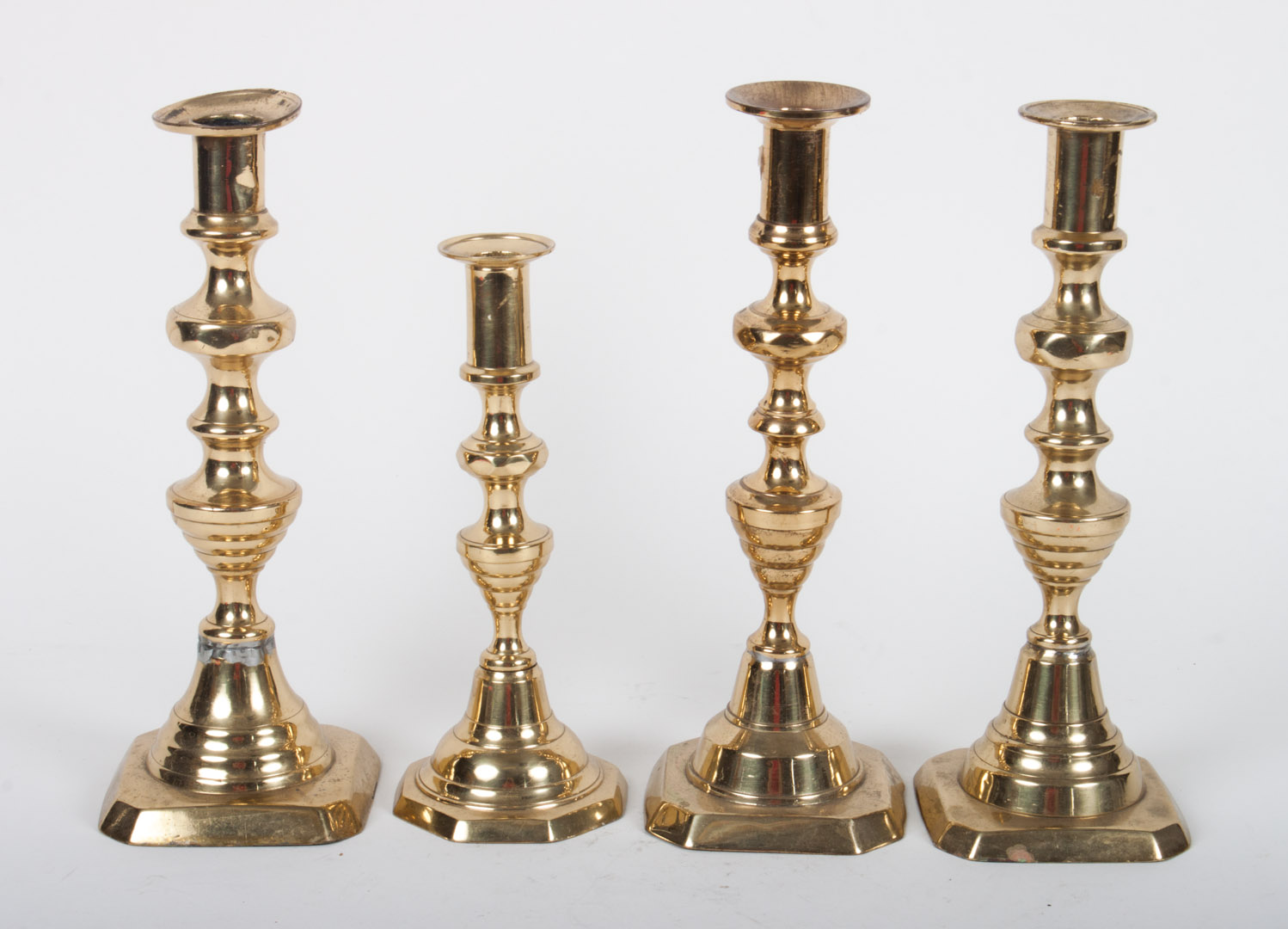 Appraisal: Four Victorian brass candlesticks late th century four different beehive