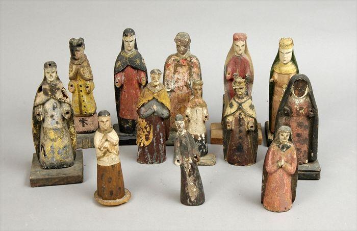 Appraisal: Thirteen Polychrome Carved Wood Santos Figures to in Provenance The