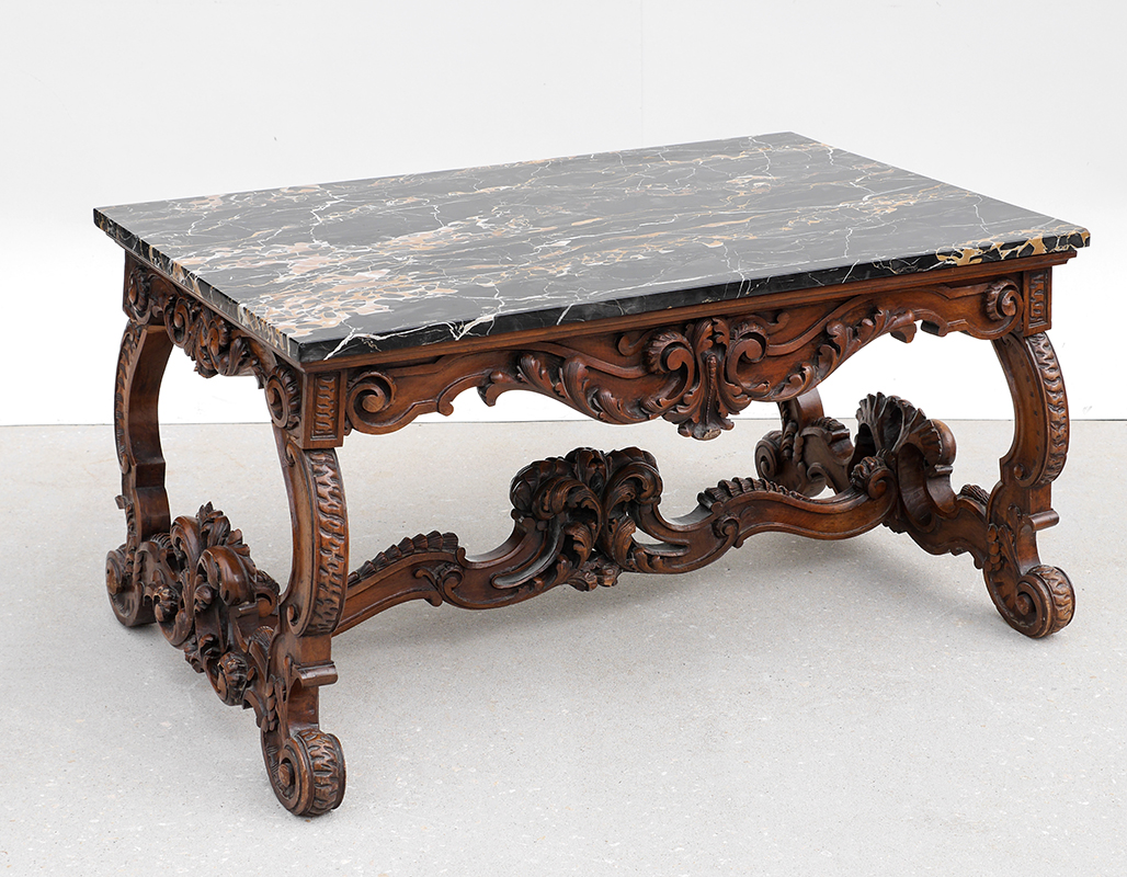 Appraisal: PROFUSELY CARVED MARBLE TOP COFFEE TABLE Base carved all over