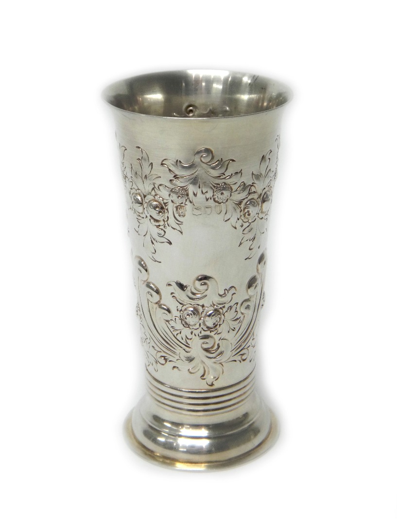 Appraisal: A Victorian silver vase of tapering form embossed with foliate