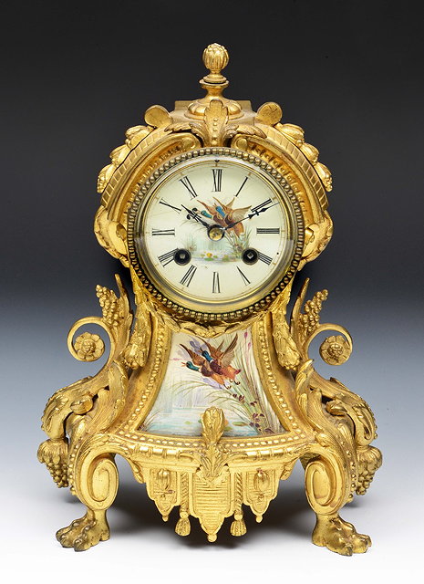 Appraisal: A th Century French ormolu mantel clockthe porcelain Roman dial