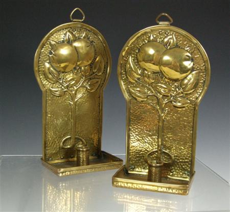 Appraisal: ARTS CRAFTS PAIR OF WALL SCONCES CIRCA brass each repouss