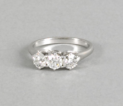 Appraisal: Platinum and diamond ring with three in-line diamonds two are