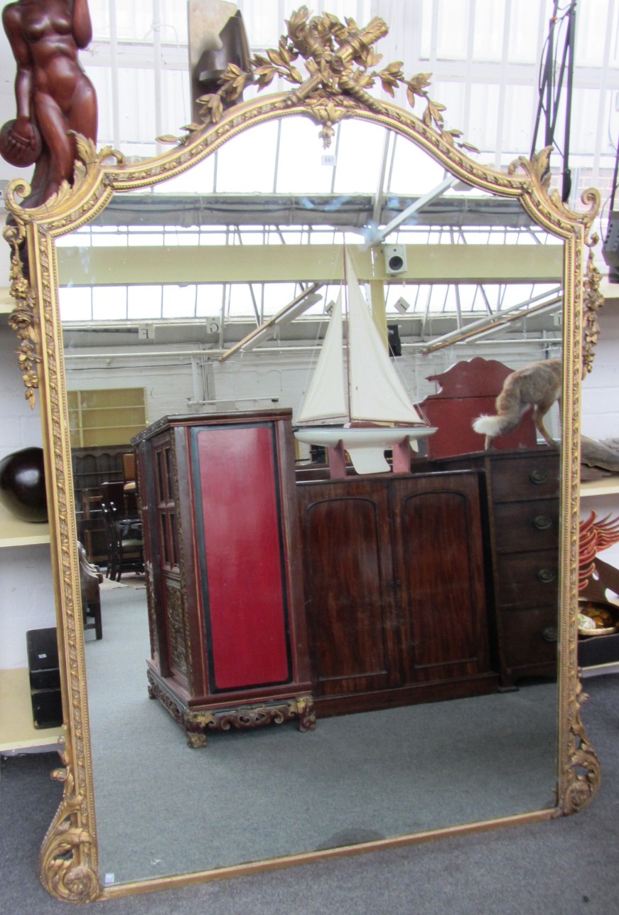 Appraisal: A large th century gilt framed wall mirror the arch