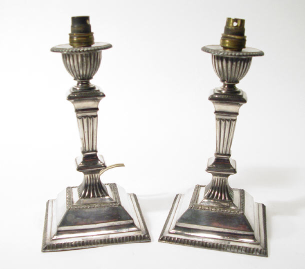 Appraisal: Pair of Edwardian square based silver plated candlesticks cm high