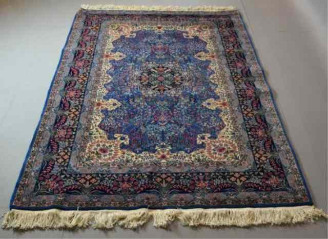 Appraisal: A FINE HAND-MADE WOOL PERSIAN AREA RUGRoyal blue field with